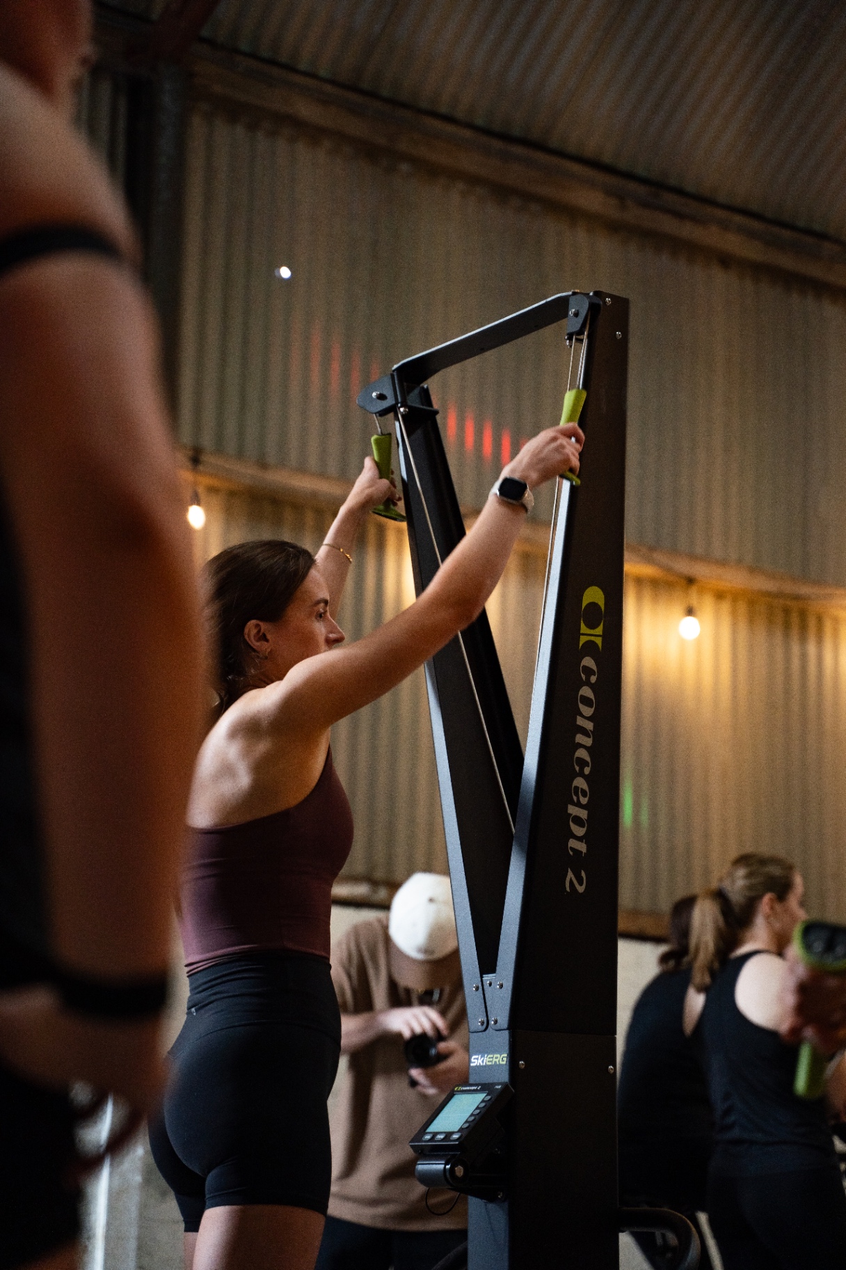 Woman using a Concept 2 SkiErg at Social Sweat Club